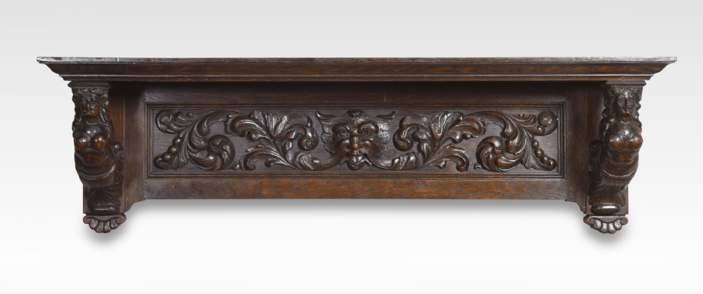 Small carved oak shelf