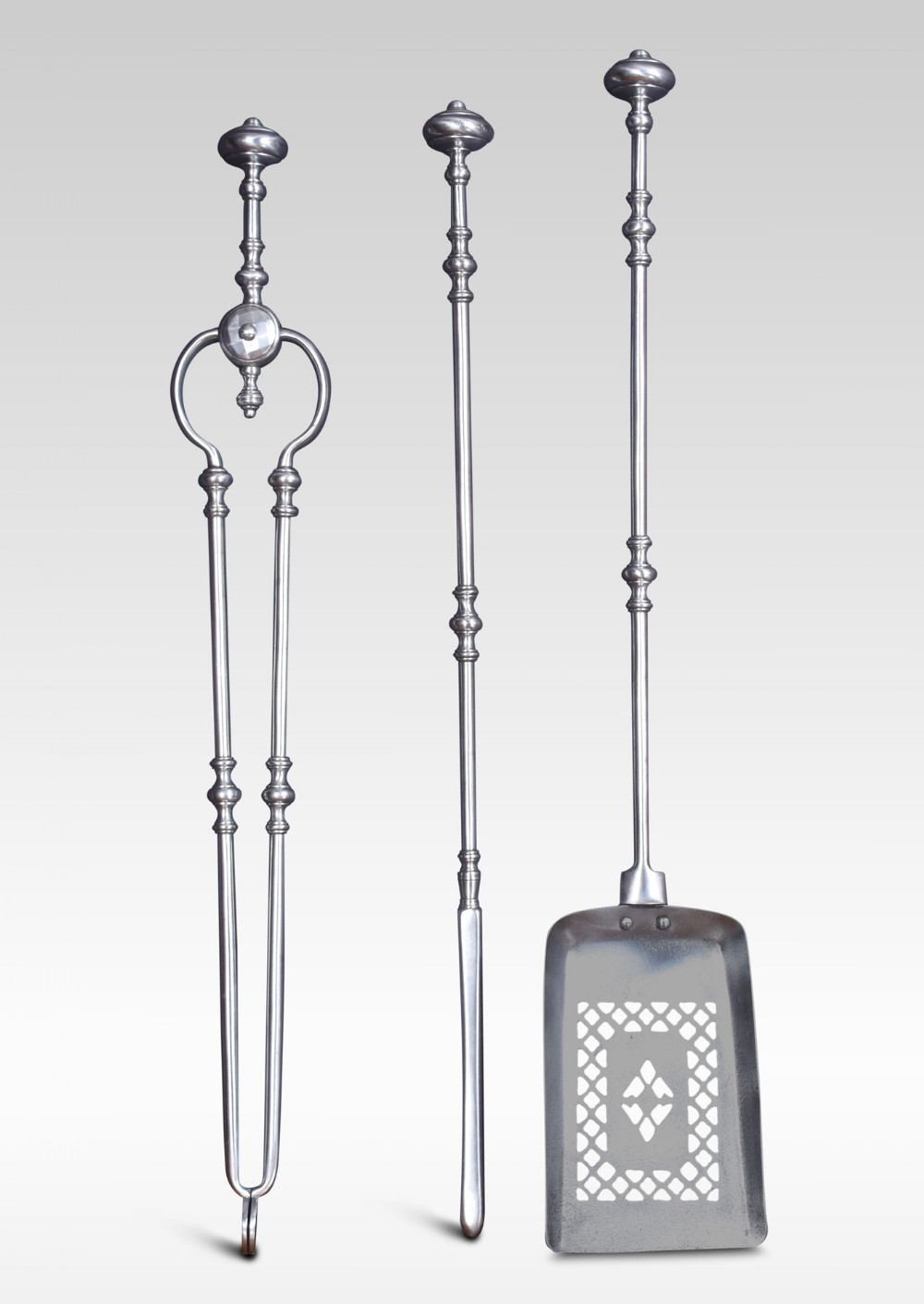 Set of three polished steel fire tools