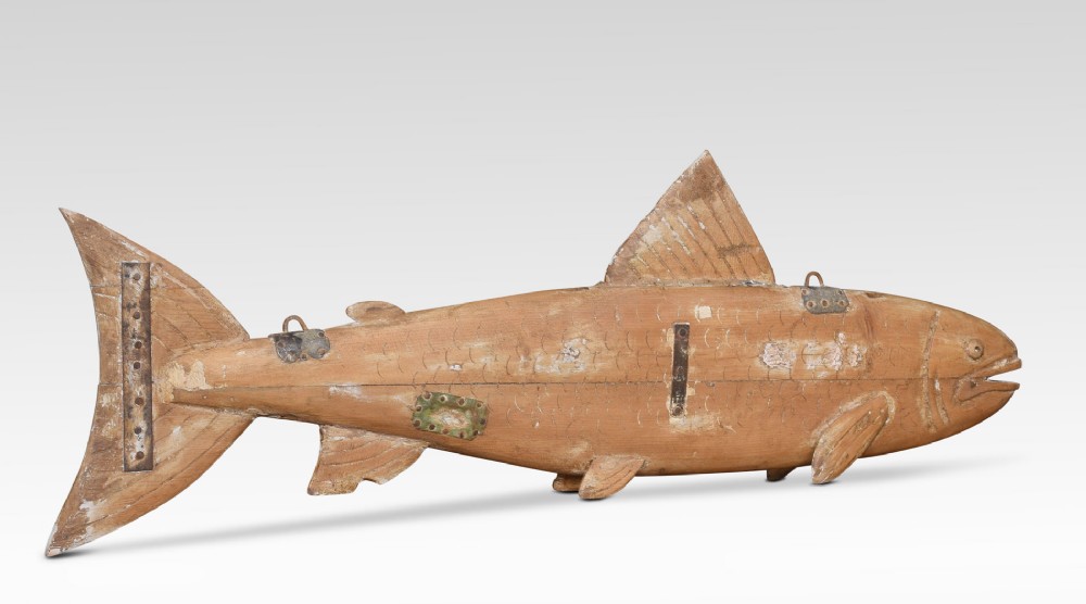 Carved pine fish shop sign
