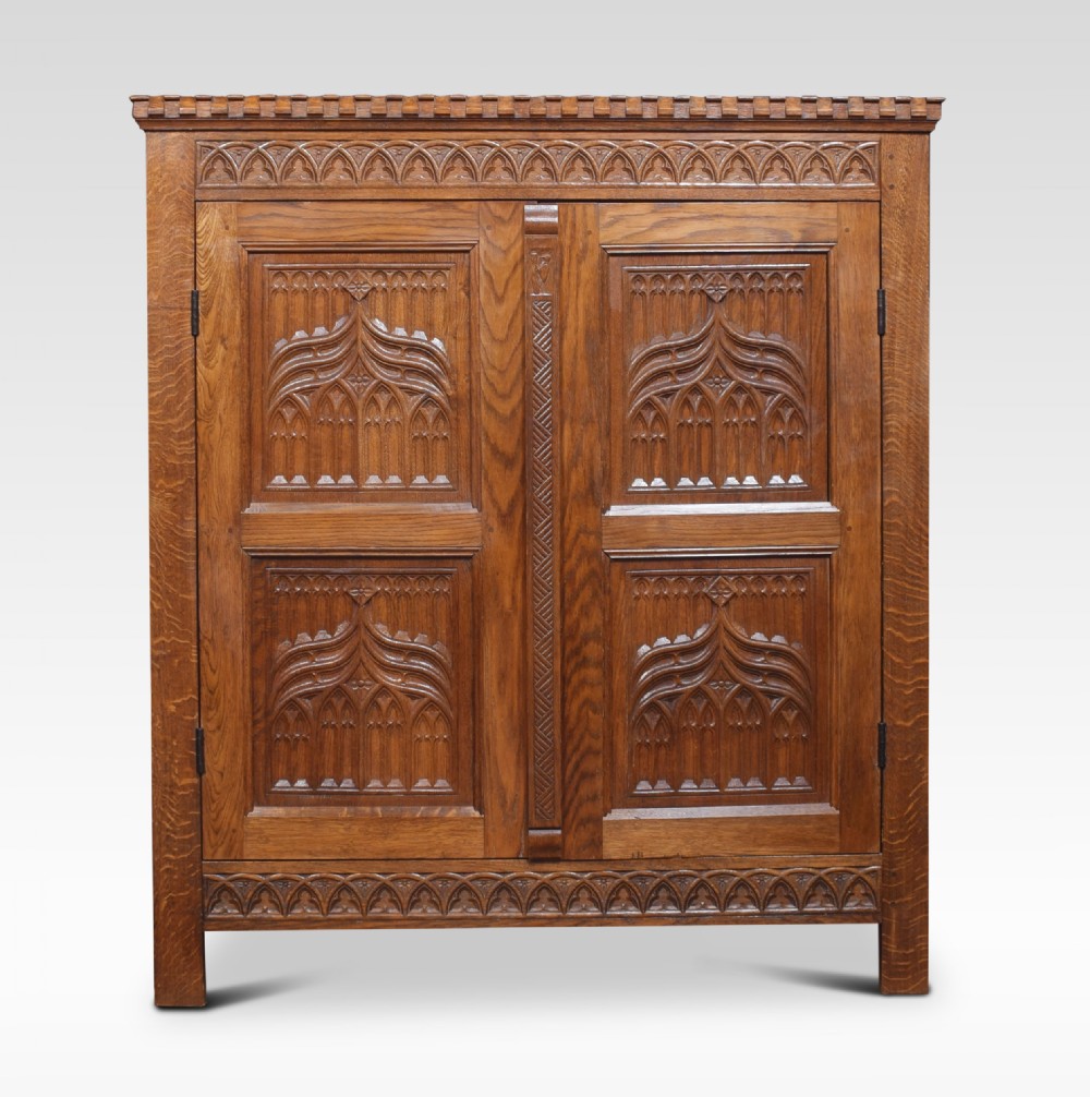 Gothic revival carved cupboard