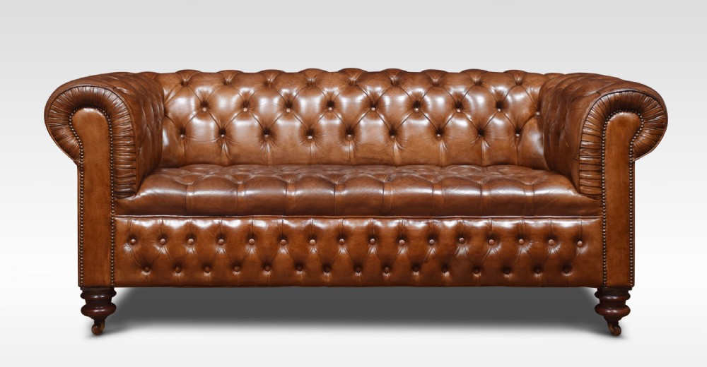 Pair of brown leather chesterfields View III