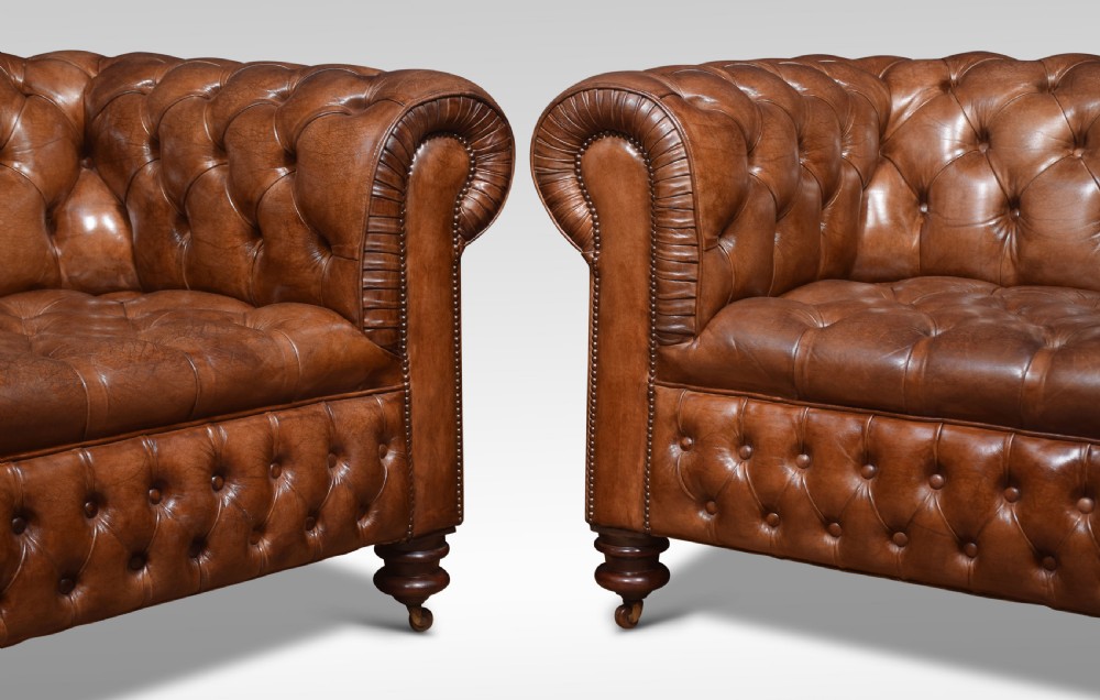 Pair of brown leather chesterfields View V
