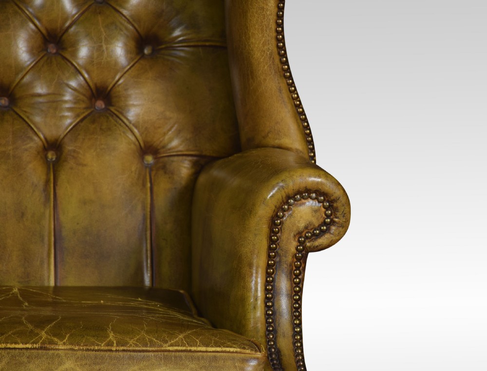 Leather upholstered wingback armchair View V