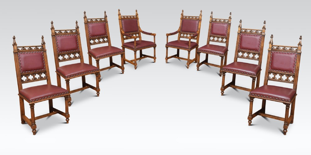 Gothic design oak refectory table and eight chairs View II