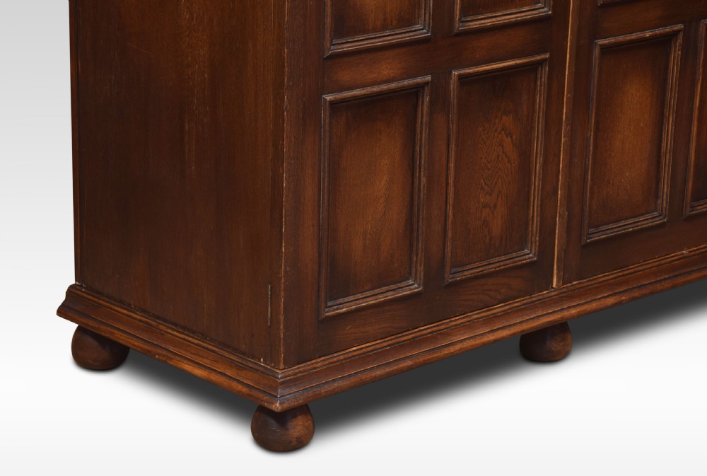 Jacobean style carved oak three door wardrobe View VIII