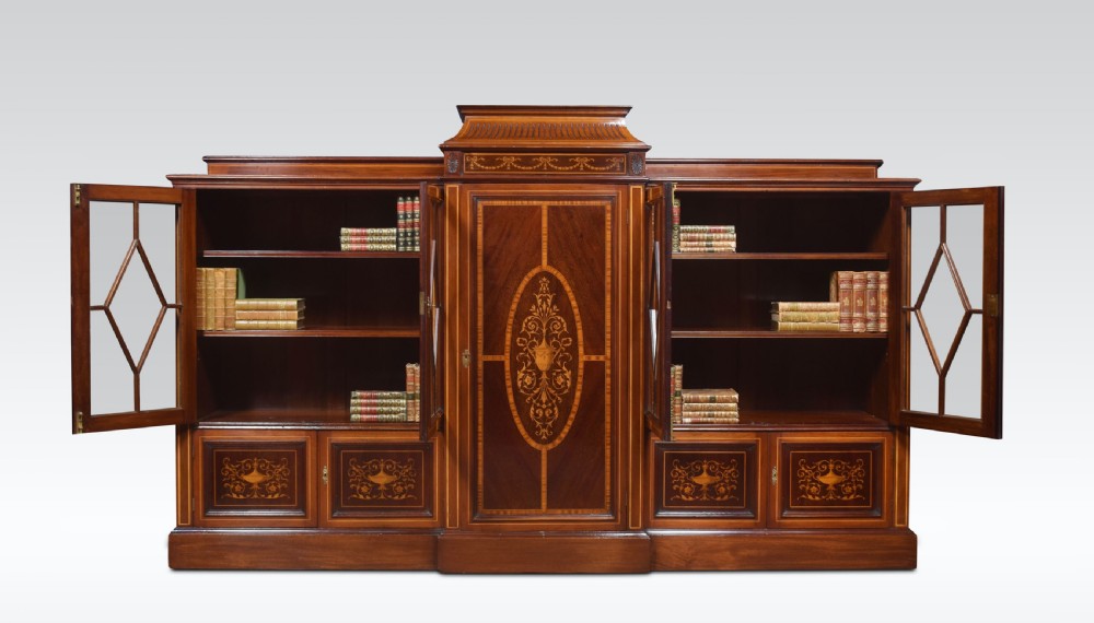 Sheraton revival mahogany inlaid breakfront bookcase View II