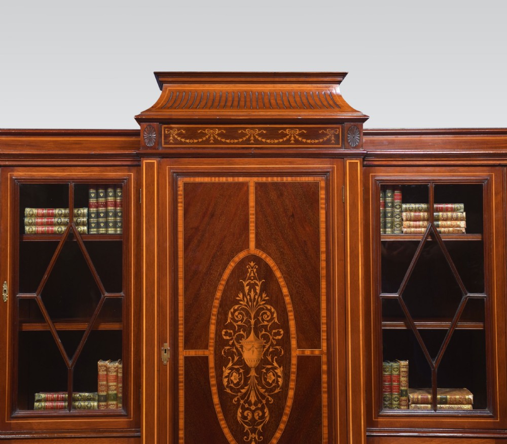 Sheraton revival mahogany inlaid breakfront bookcase View VI