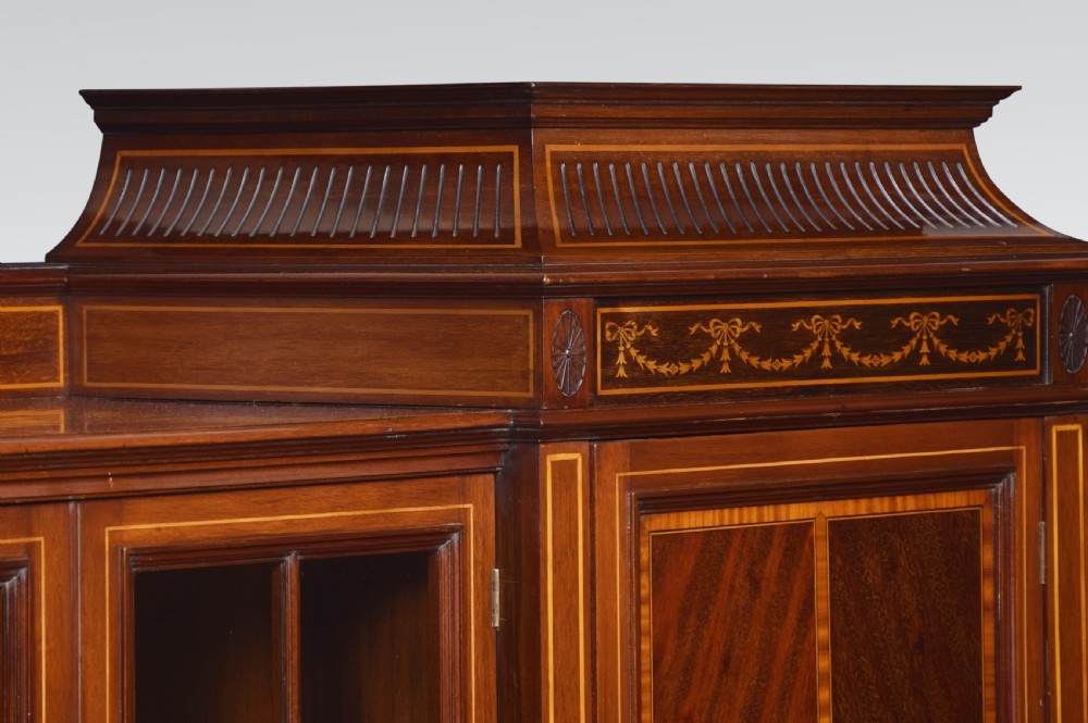 Sheraton revival mahogany inlaid breakfront bookcase View X