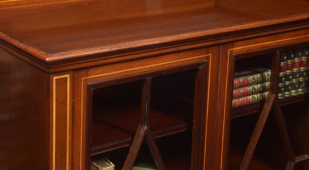 Sheraton revival mahogany inlaid breakfront bookcase View XI