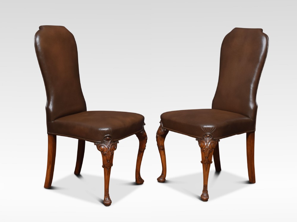 Set of eight high back brown leather upholstered dining chairs View III
