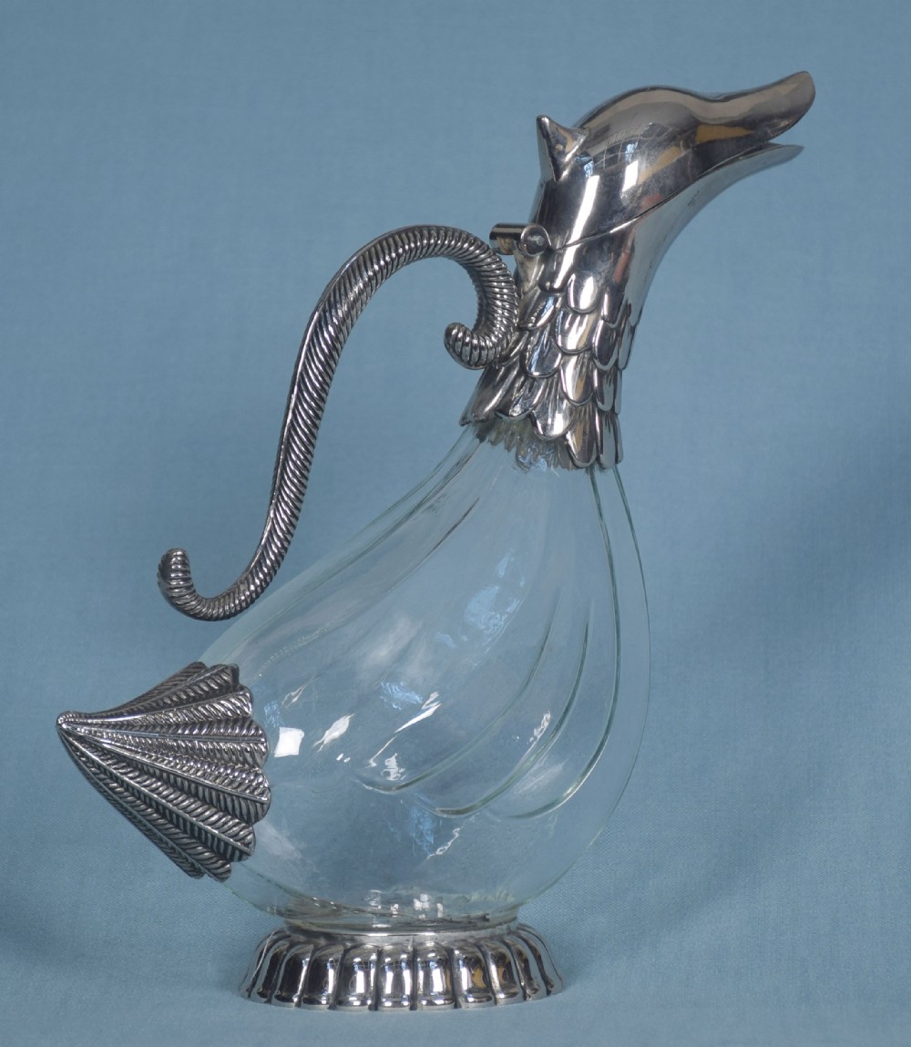 Silver plated and glass claret jug