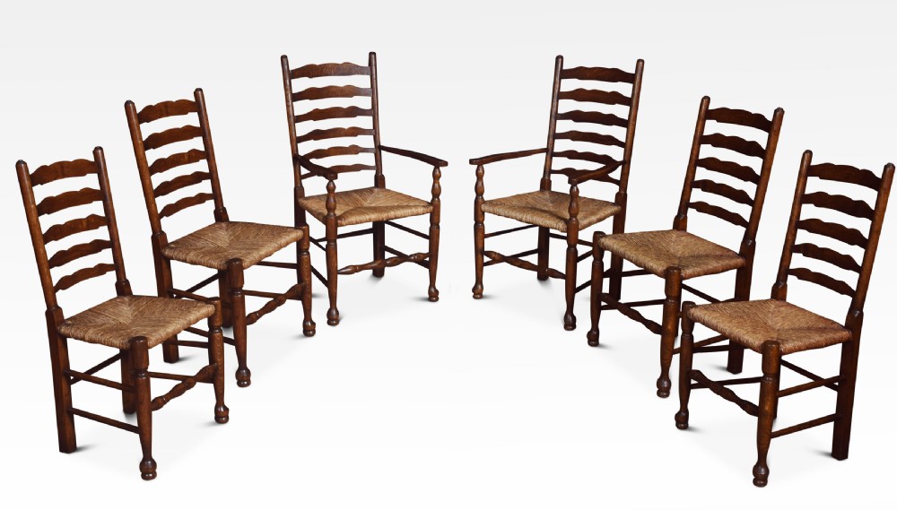 Set of six oak ladder back dining chairs