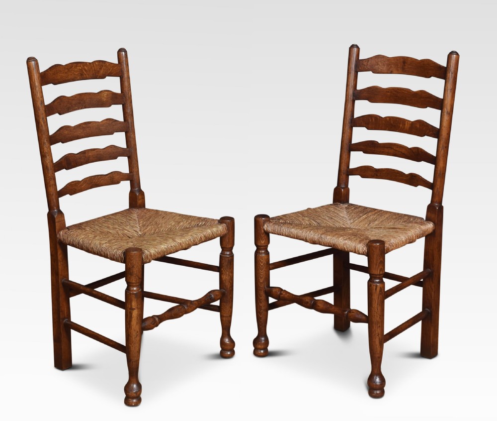 Set of six oak ladder back dining chairs View VII
