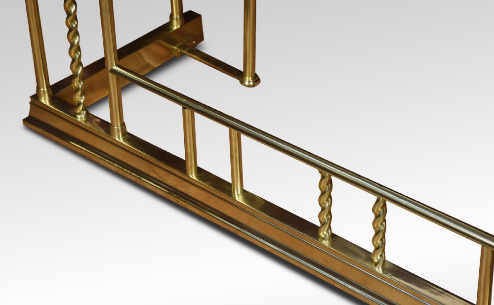 Edwardian brass and leather upholstered club fender View III