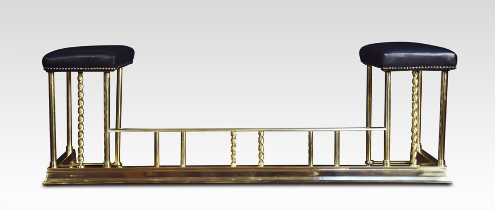 Edwardian brass and leather upholstered club fender View V