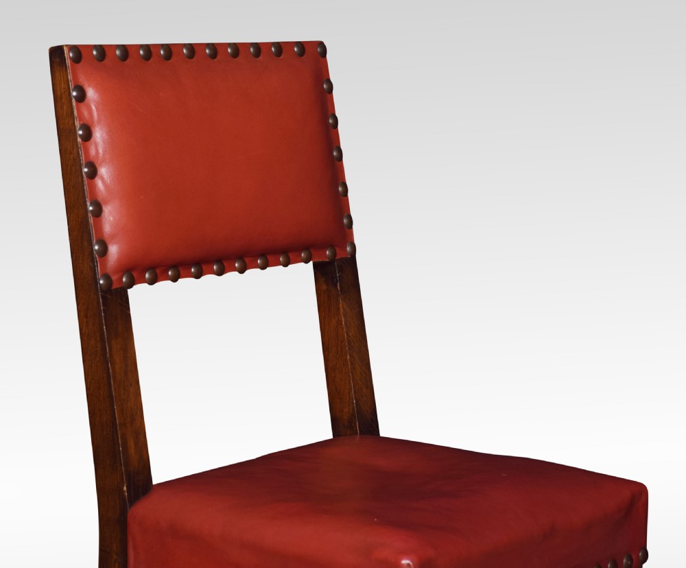 Set of fourteen leather uppolstered substantial oak dining chairs View II