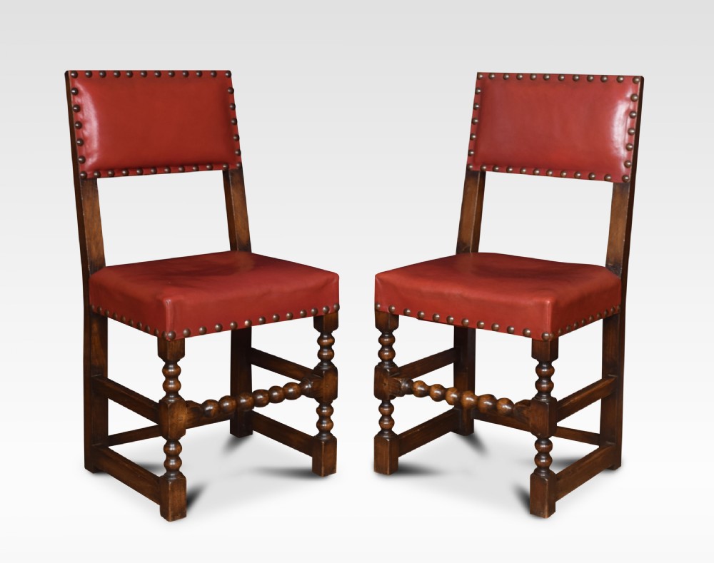 Set of fourteen leather uppolstered substantial oak dining chairs View V