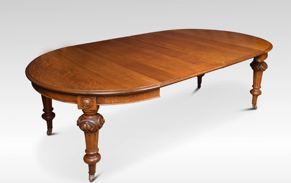 Oak oval extending dining table