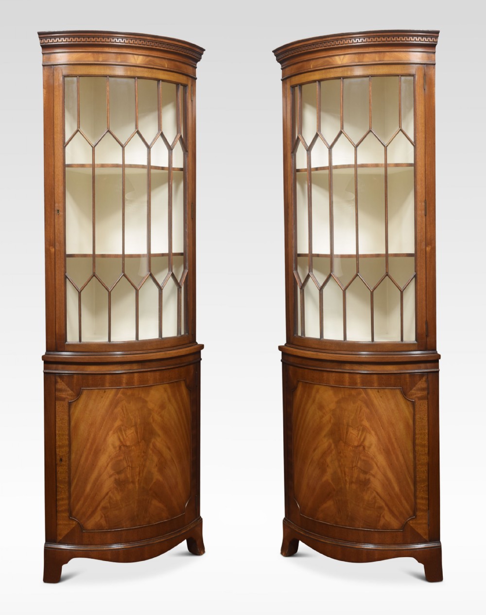 Pair of George III style mahogany corner cabinets