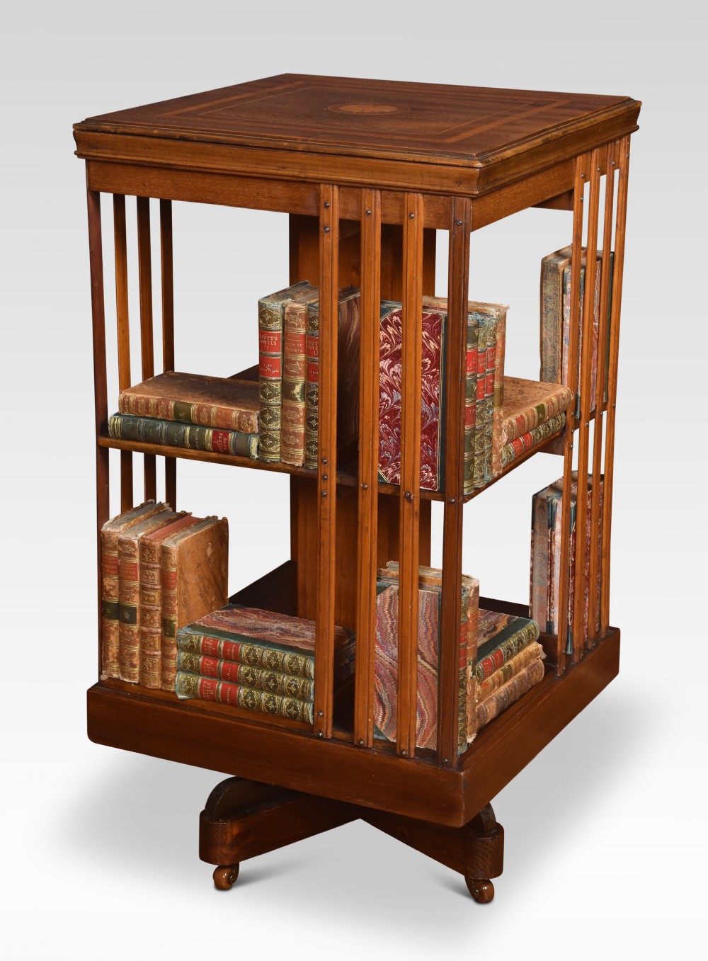 Mahogany inlaid revolving bookcase