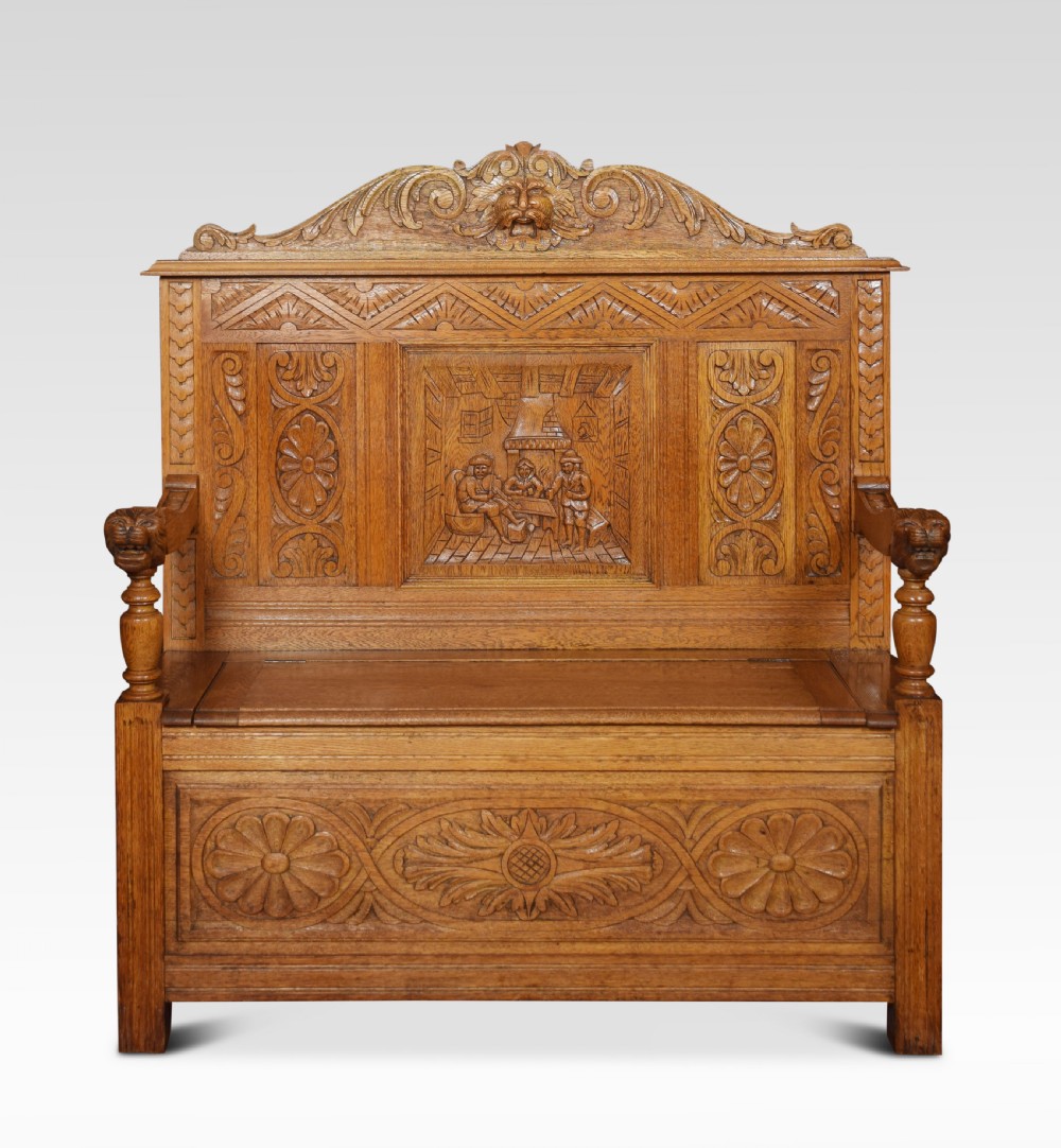 Carved oak hall settle