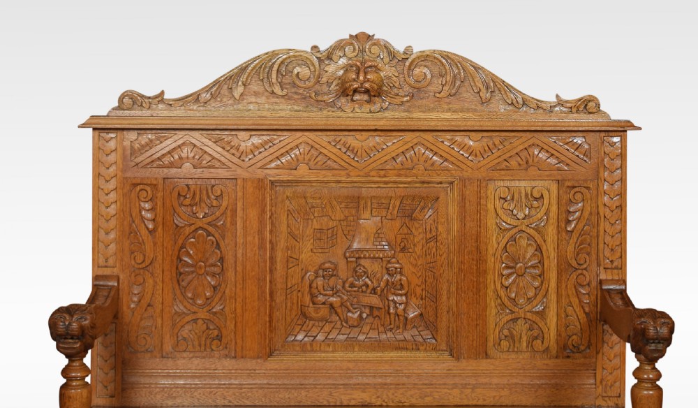 Carved oak hall settle View II