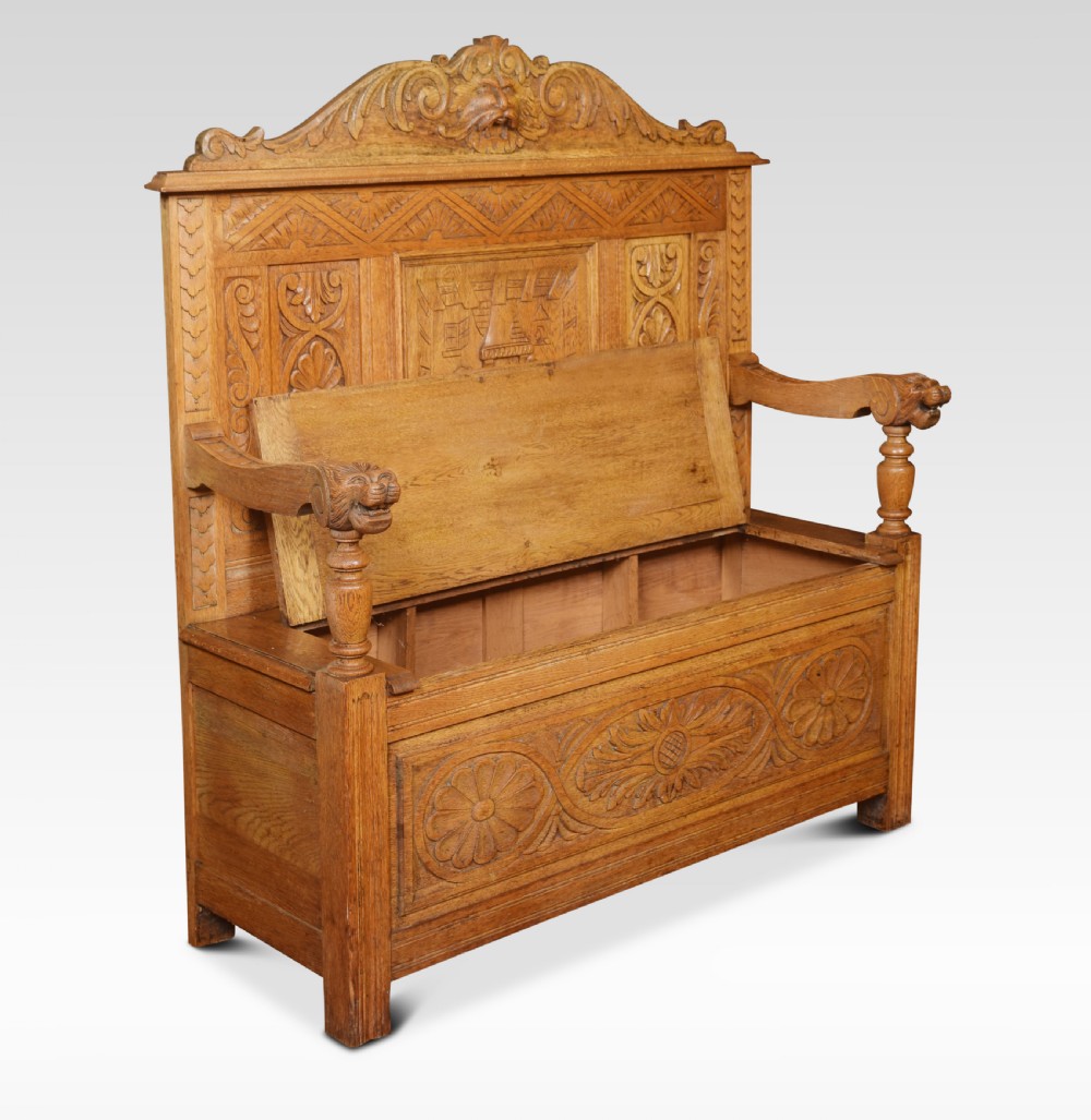 Carved oak hall settle View III