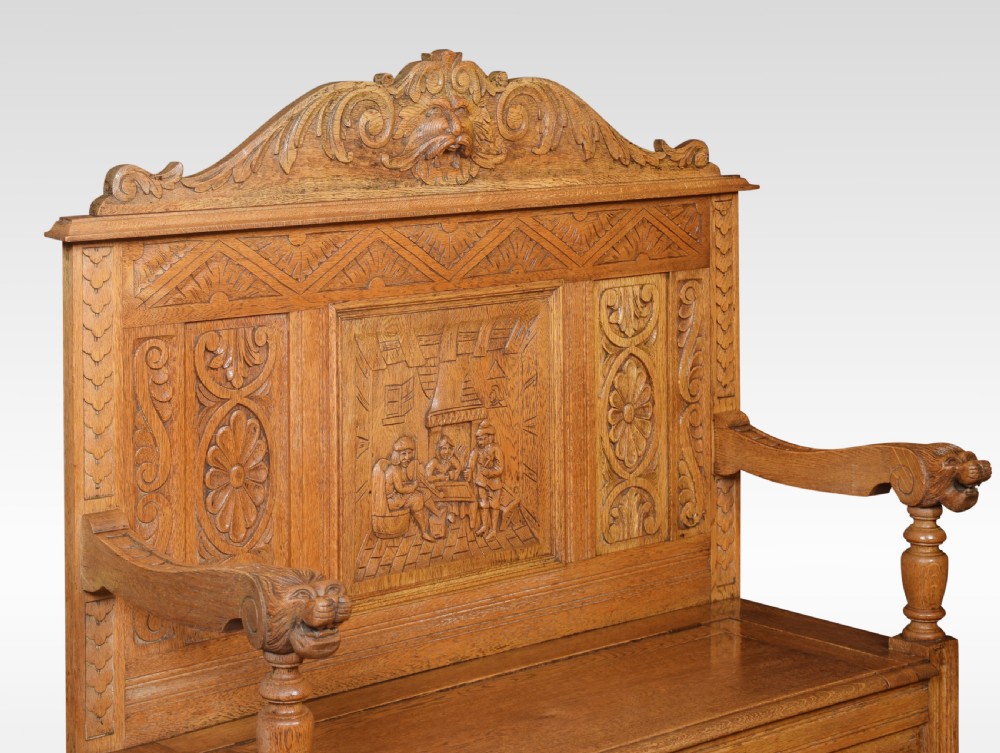 Carved oak hall settle View VII