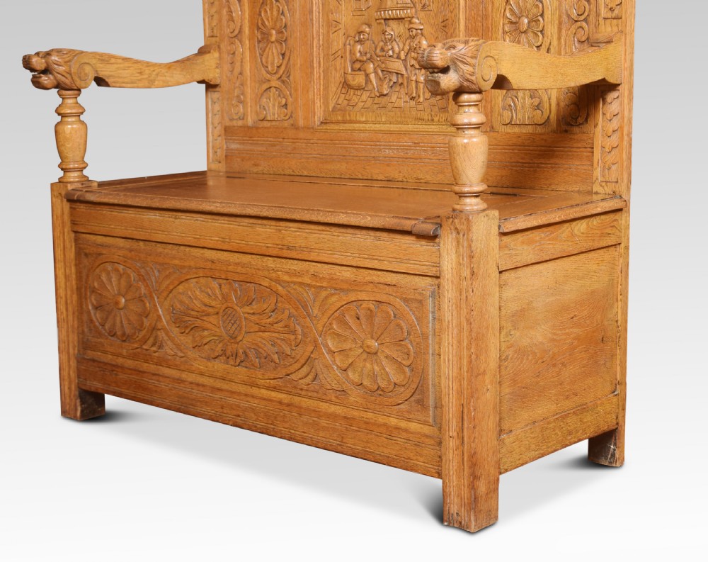 Carved oak hall settle View IX