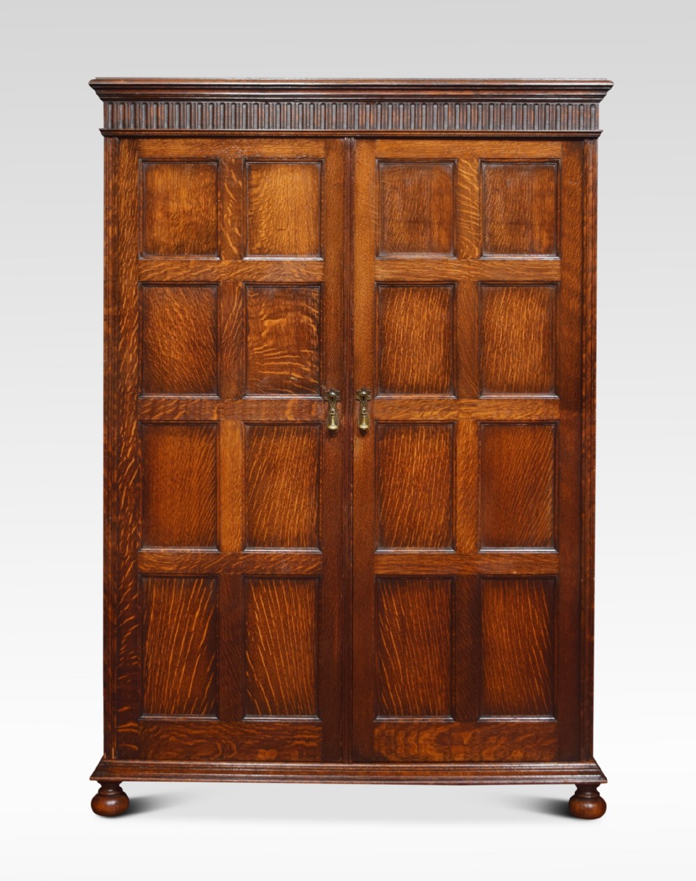 Carved oak two door compactum wardrobe