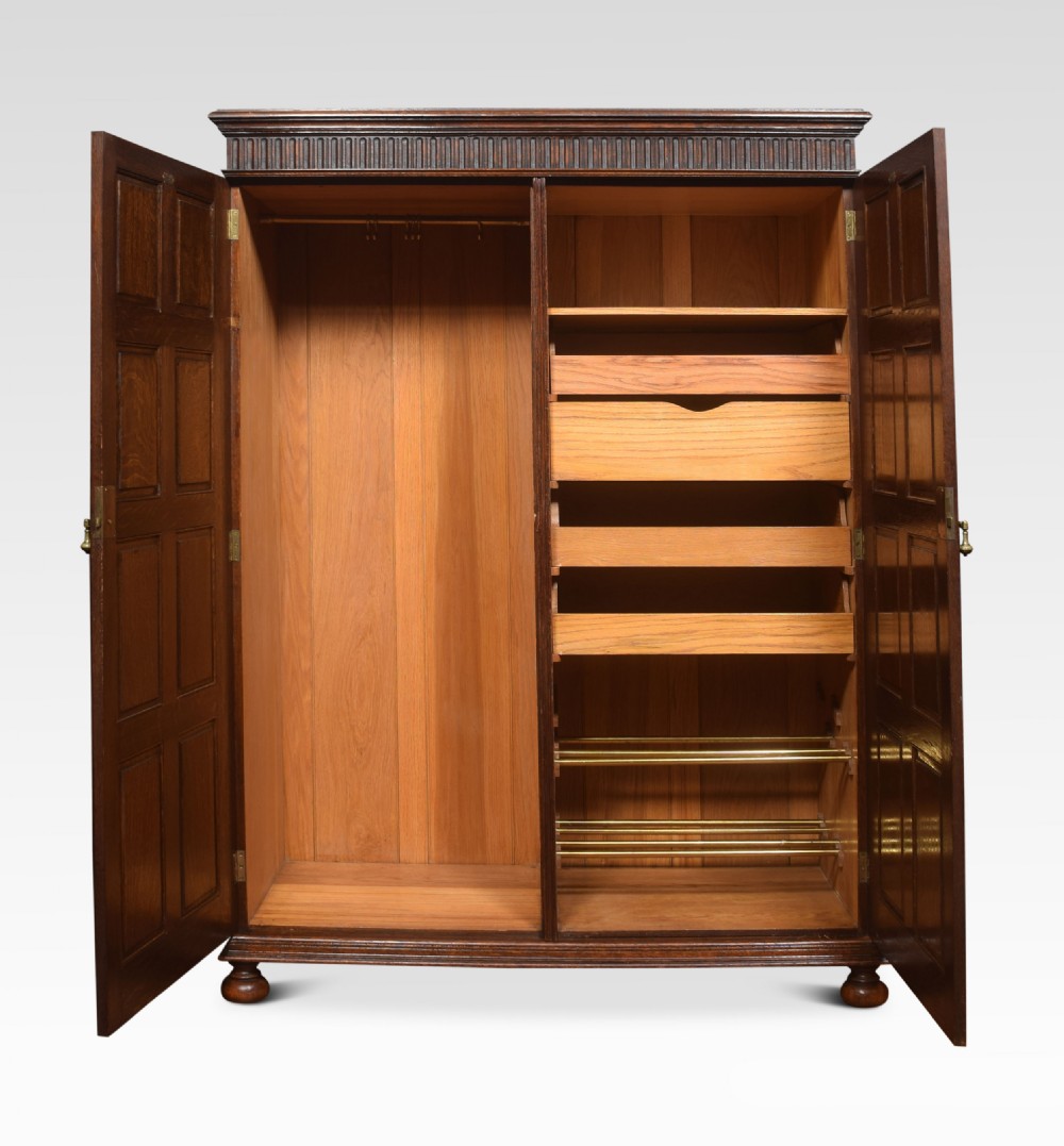 Carved oak two door compactum wardrobe View V
