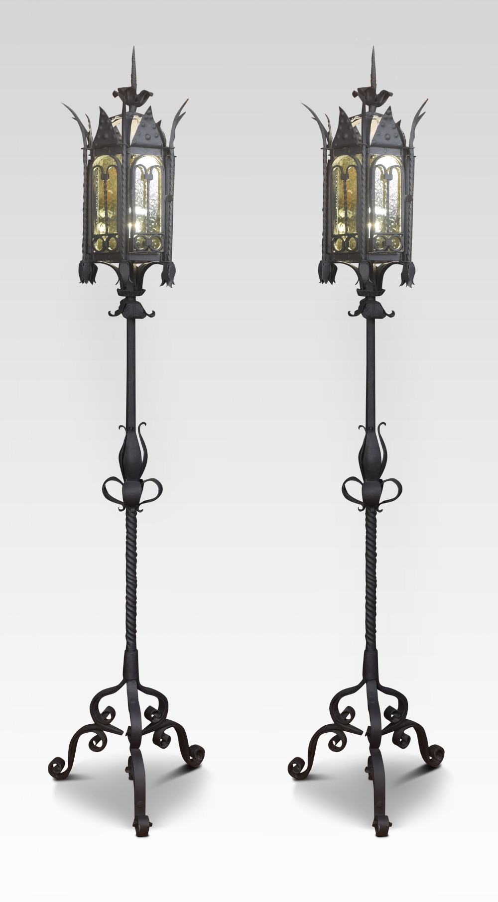 Pair of gothic style ironwork standard lamps