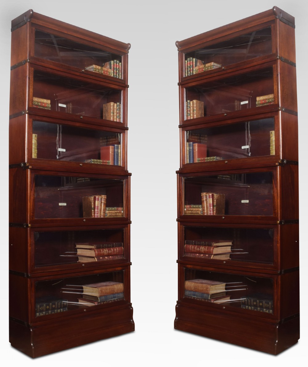 Pair of mahogany globe Wernicke six section bookcases