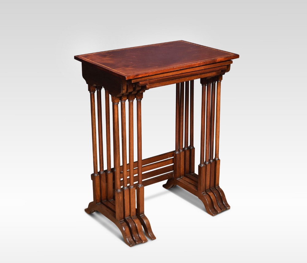 Nest of four mahogany inlaid tables