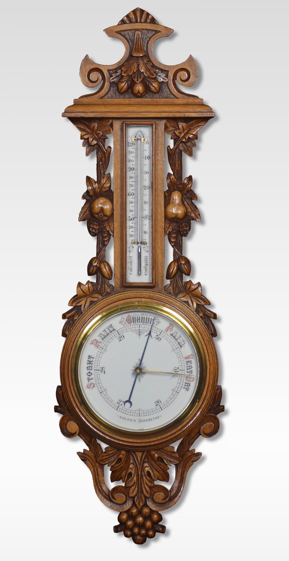 Carved oak barometer