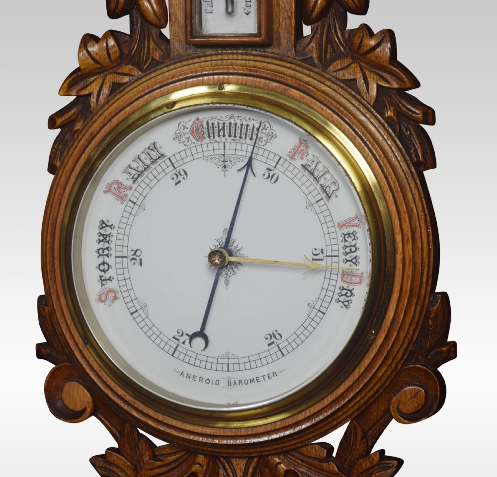 Carved oak barometer View III