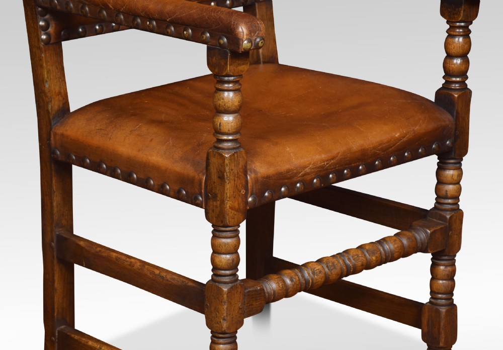 Eight leather upholstered oak dining chairs View VI