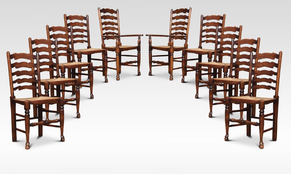 Set of ten oak ladder back dining chairs