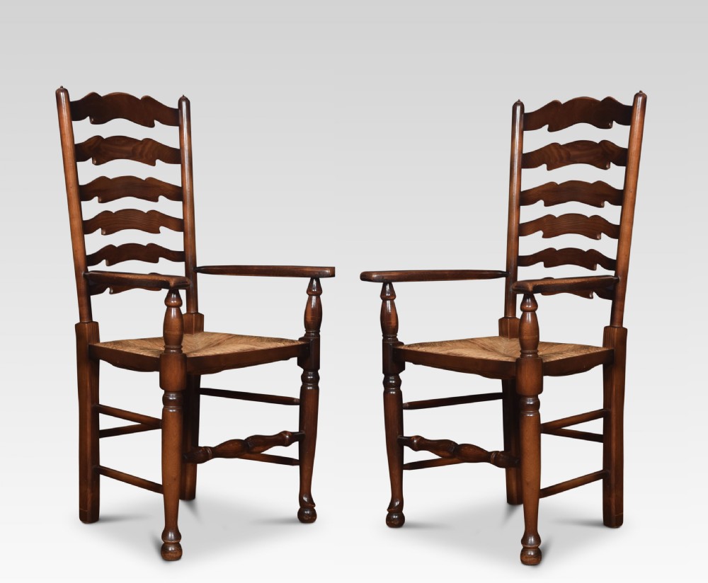 Set of ten oak ladder back dining chairs View II