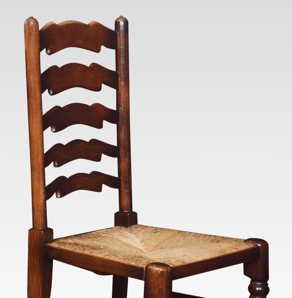 Set of ten oak ladder back dining chairs View VI