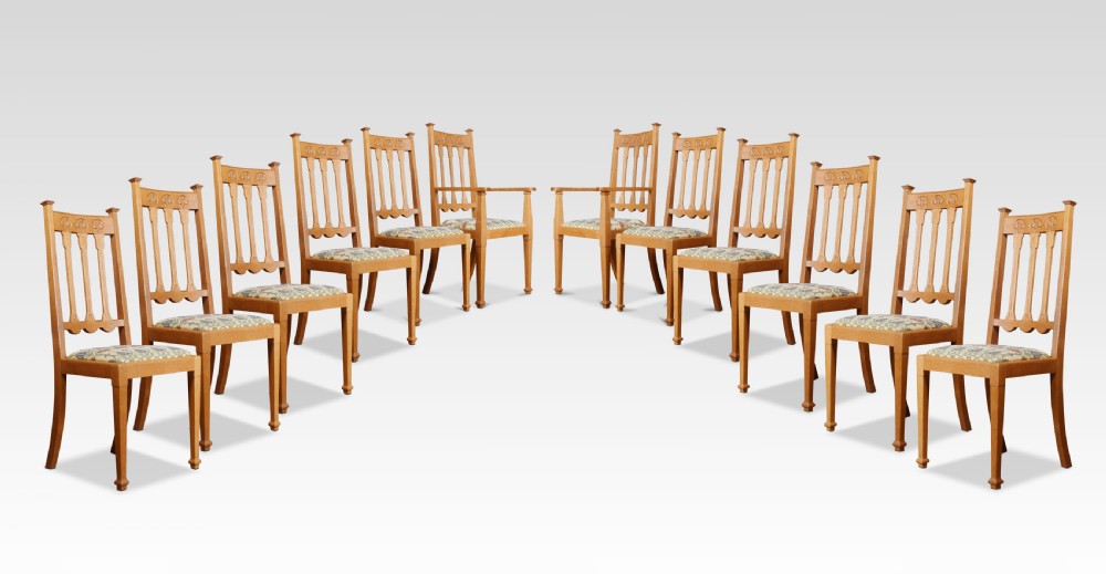Set of twelve oak Arts and Crafts dining chairs