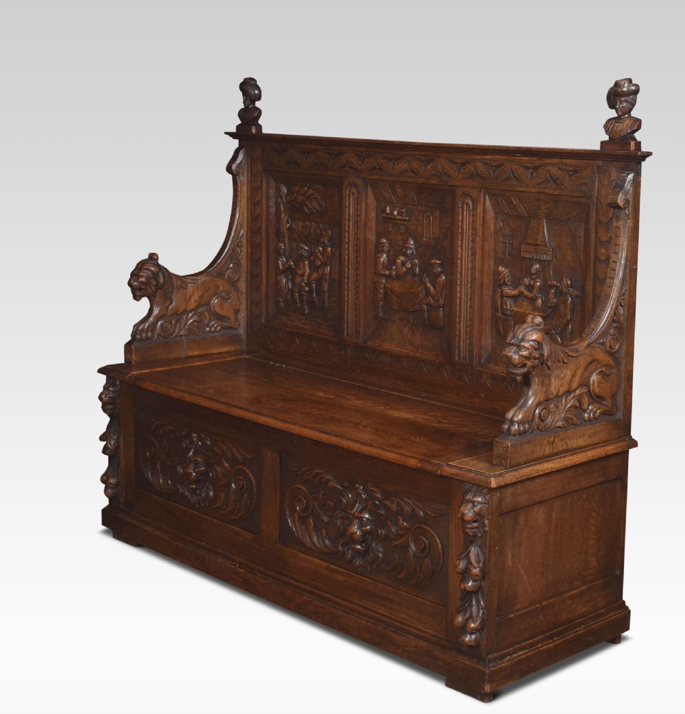 Carved oak hall settle