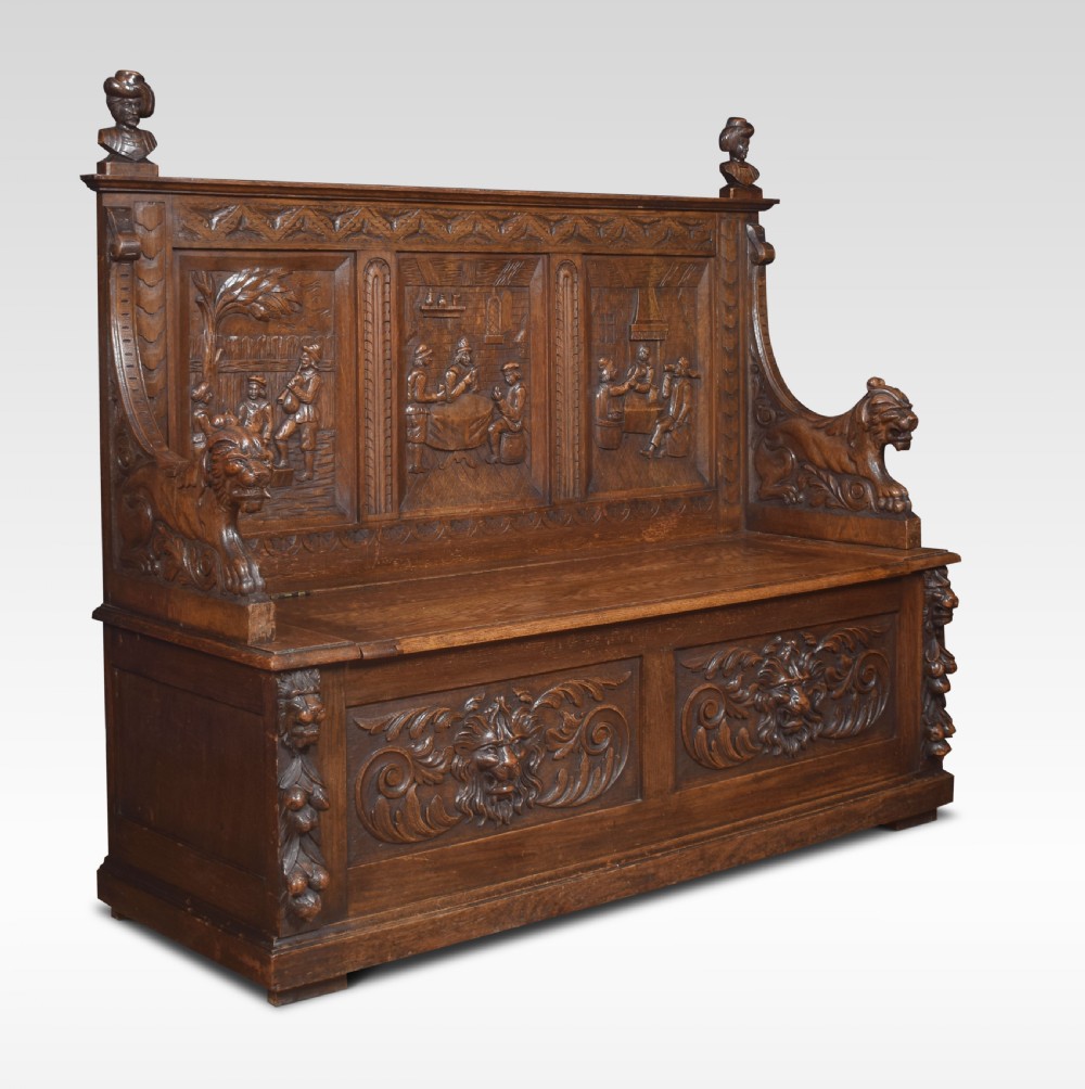 Carved oak hall settle View III