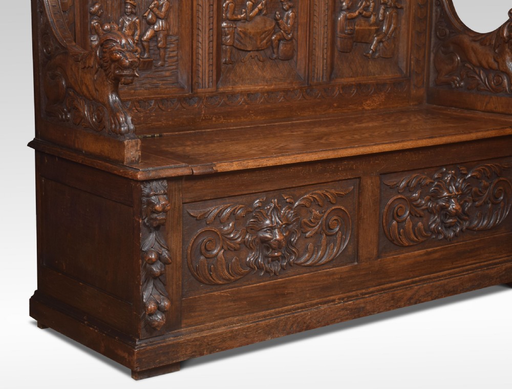 Carved oak hall settle View V