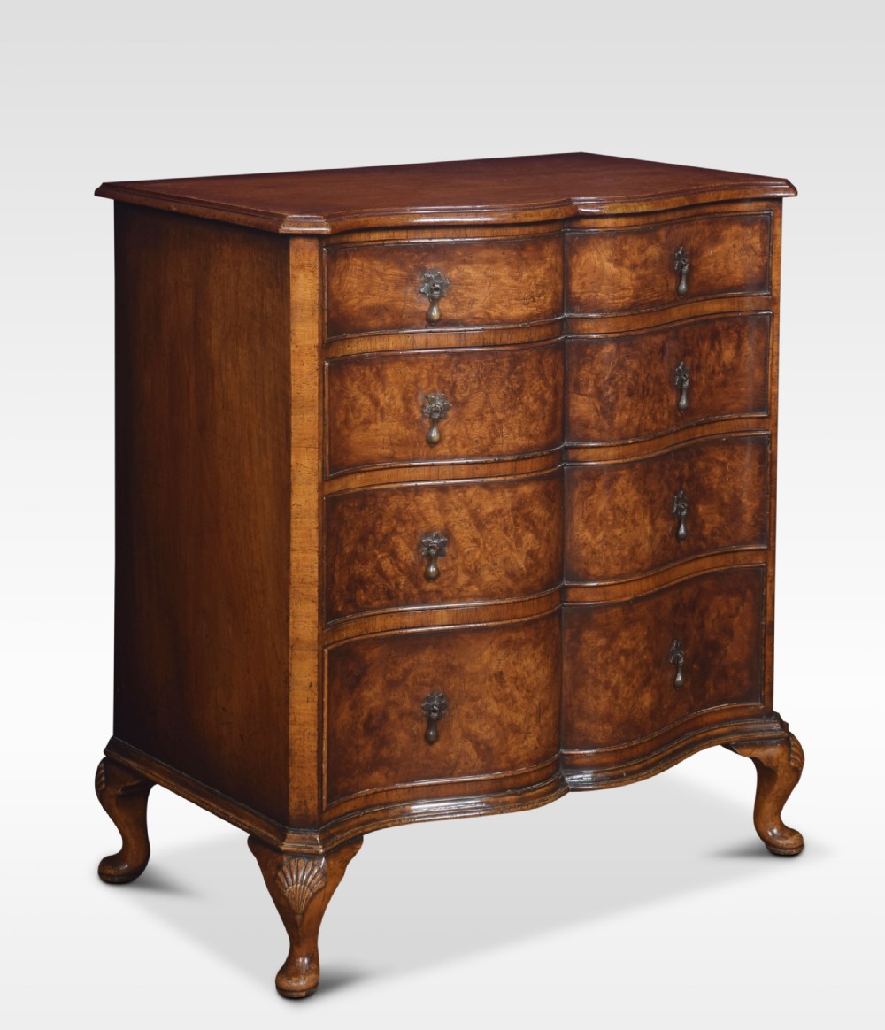 Figured walnut serpentine fronted chest of drawers