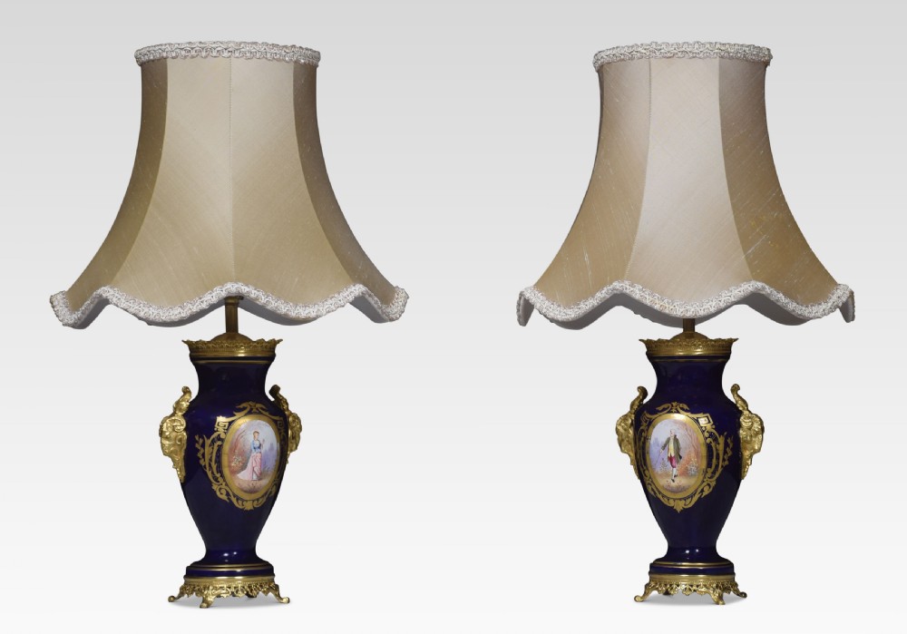 Pair of Sevres porcelain painted vase form table lamps