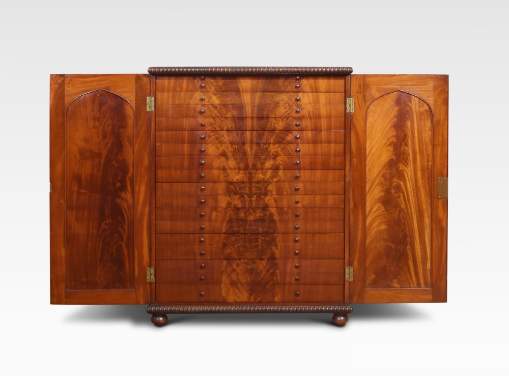 Flame mahogany collector’s cabinet