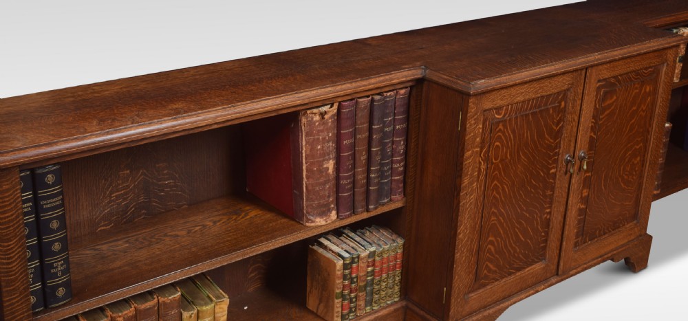 Very large oak dwarf breakfront bookcase View III