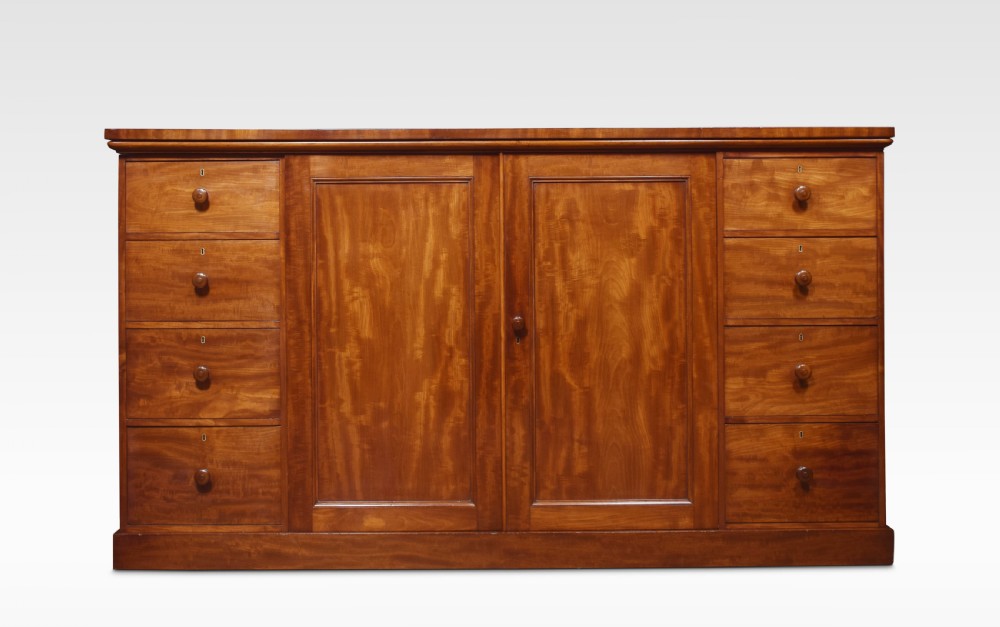 Mahogany low linen press by Holland and Sons