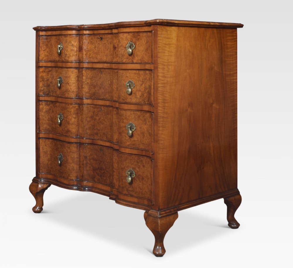 Figured walnut serpentine fronted chest of drawers View IX